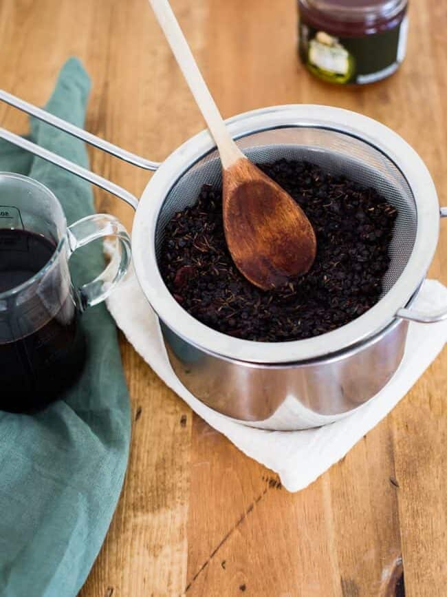 Strained Homemade Elderberry Syrup | HelloGlow.co